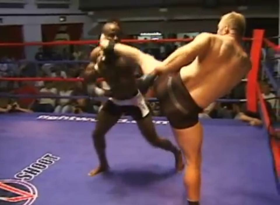 John Renken delivering a head kick in the ring