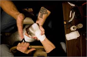 Fighter wrapping hands before a bout